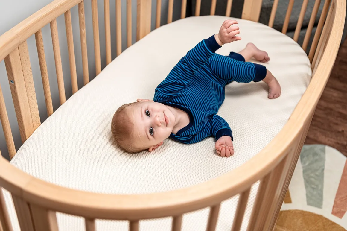 Naturepedic Organic Cotton Oval Crib Mattress with Breathable Cover for Stokke Sleepi V3