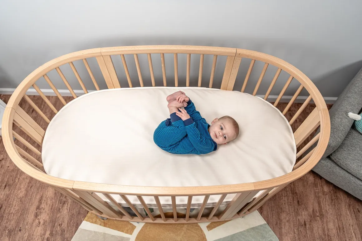Naturepedic Organic Cotton Oval Crib Mattress with Breathable Cover for Stokke Sleepi V3