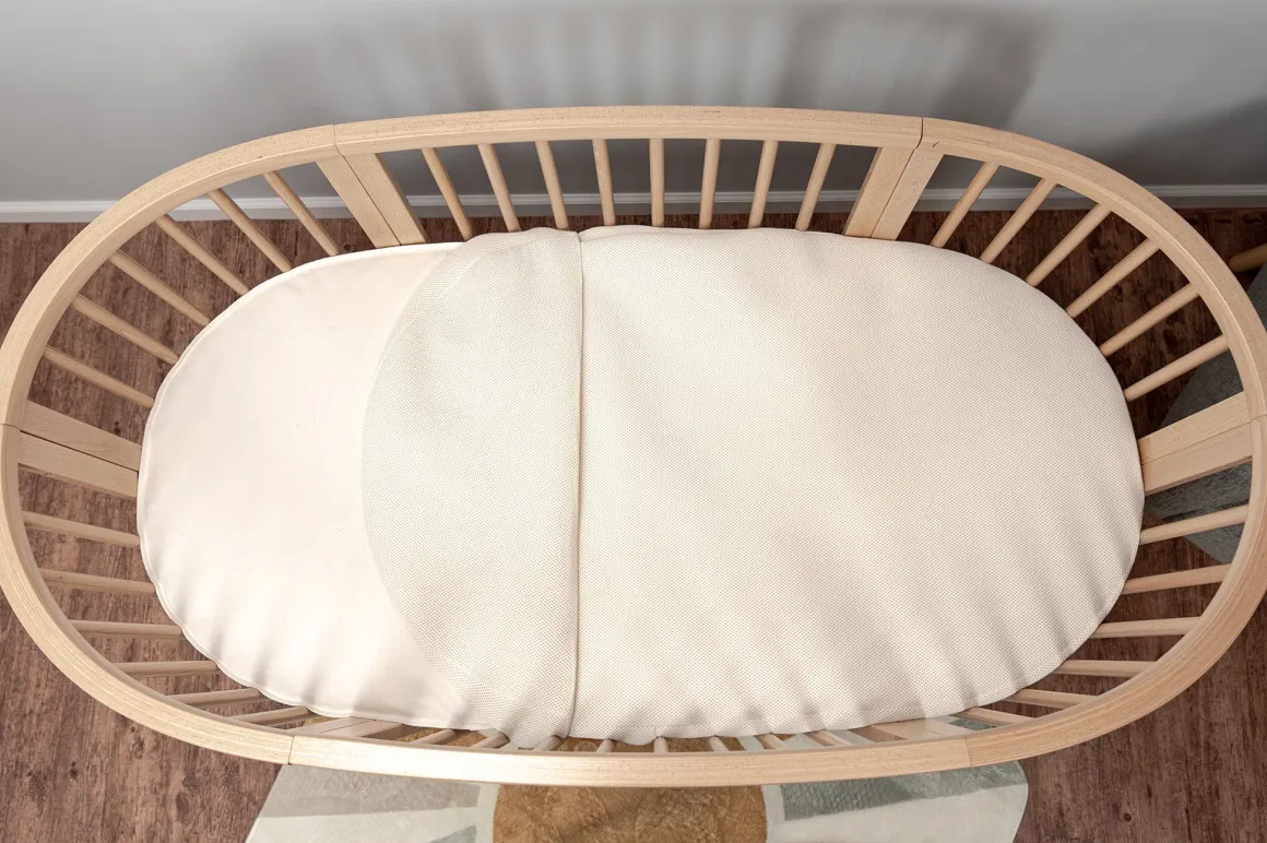 Naturepedic Organic Cotton Oval Crib Mattress with Breathable Cover for Stokke Sleepi V3